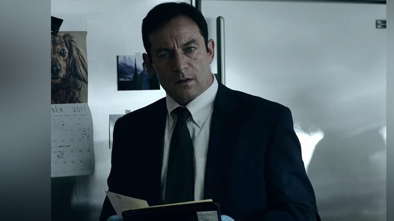 Michael Britten (Jason Isaacs) holding a notepad on "Awake."