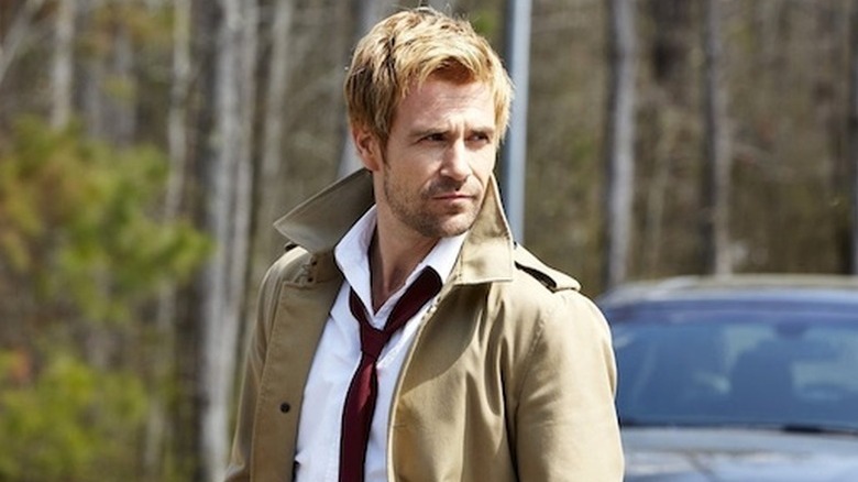 John Constantine (Matt Ryan) standing in front of a car on "Constantine."