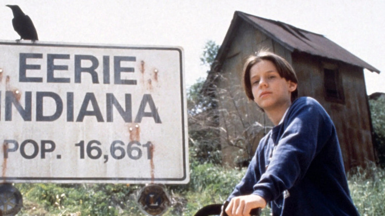 Marshall (Omri Katz) sitting on a bike on "Eerie, Indiana."