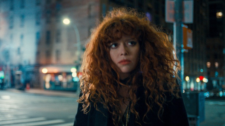 Nadia looks to her left while strolling in "Russian Doll."