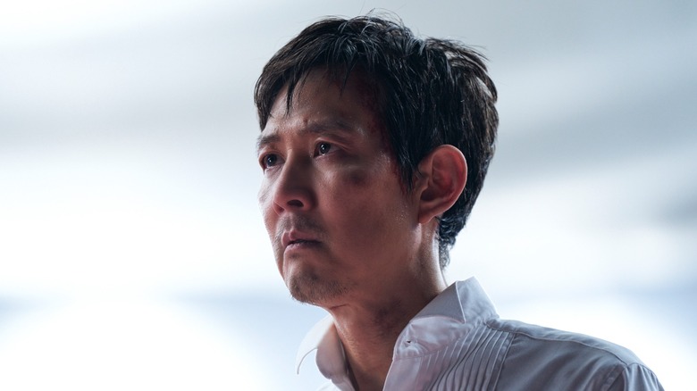 Seong Gi-hoon looks off into the distance in "Squid Game."