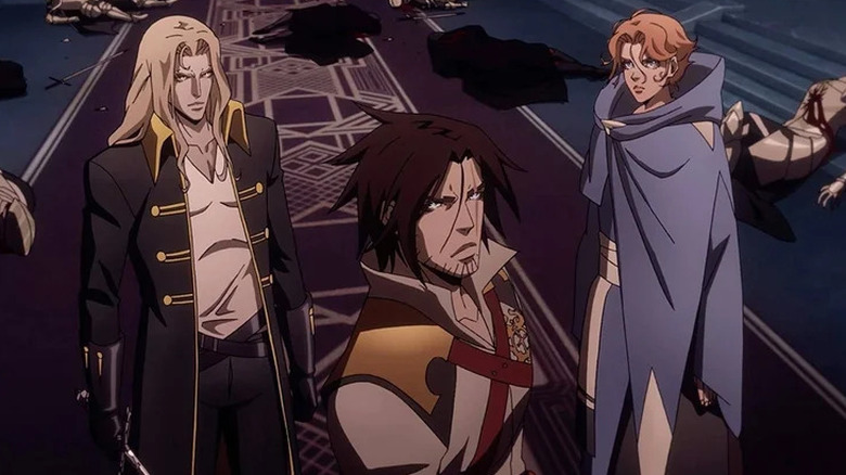 Alucard (James Callis), Trevor Belmont (Richard Armitage), and Sypha Belnades (Alejandra Reynoso) stand defiantly in Castlevania