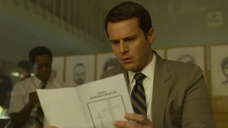 Holden Ford (Jonathan Groff) studies a church program in Mindhunter