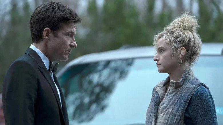 Marty Byrde (Jason Bateman) and Ruth Langmore (Julia Garner) stare sternly at each other in Ozark