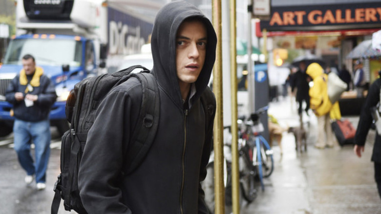 Elliot Alderson (Rami Malek) patrols the streets on Mr. Robot
