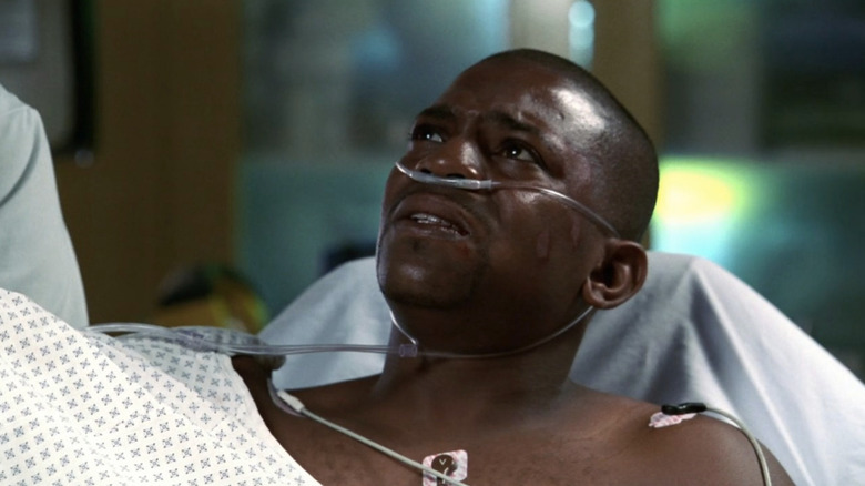 Mekhi Phifer as Pratt sitting up in hospital bed in "ER."