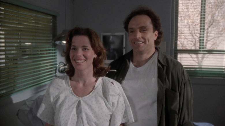 Colleen Flynn as Jodi and Bradley Whitford as Sean smiling in hospital room in "ER."