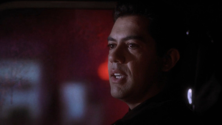 Carlos Gómez as Raul sitting in passenger seat of ambulance in "ER."
