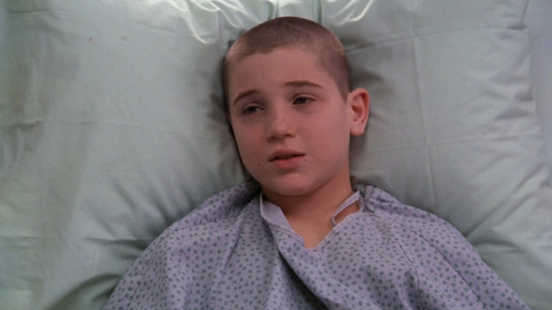 Trevor Morgan as Scotty Anspaugh with shaved head in hospital bed in "ER."