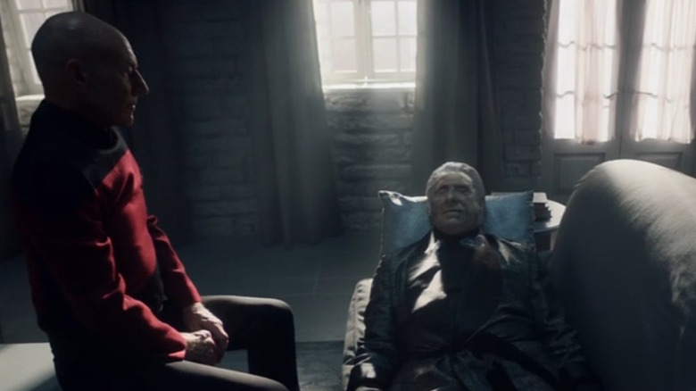 Jean-Luc Picard (Patrick Stewart) stands over an aged and deceased Data (Brent Spiner) in Star Trek: Picard