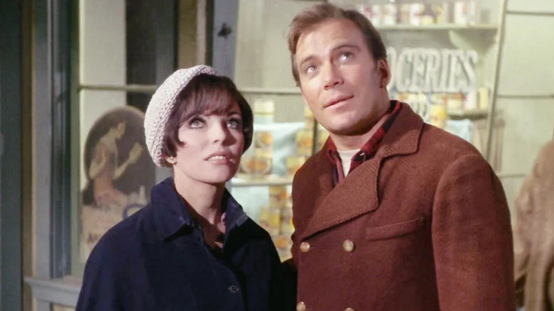 Edith Keeler (Joan Collins) and James Kirk (William Shatner) gaze up at the stars in Star Trek: The Original Series