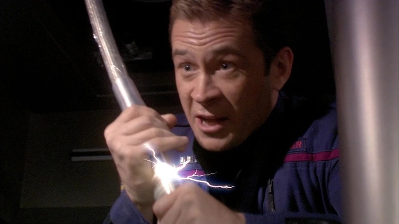 Trip Tucker (Connor Trinneer) opens a power coil in Star Trek: Enterprise