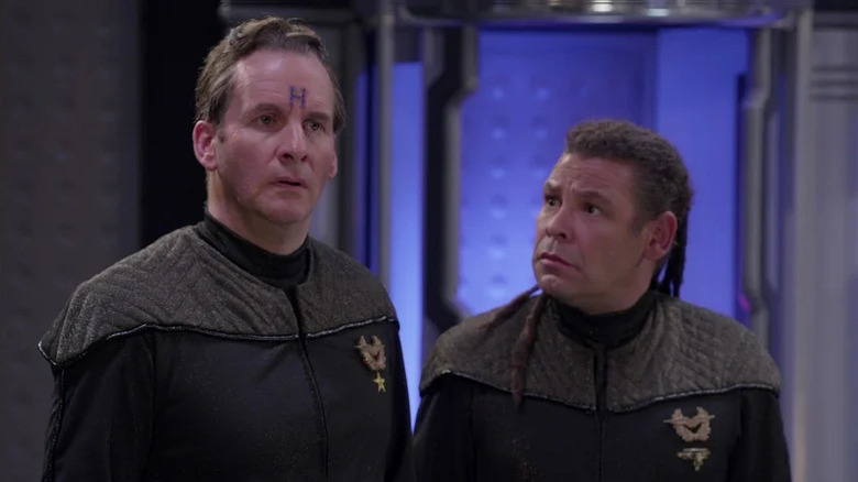 A bewildered Dave Lister (Craig Charles) looks at Arnold Judas Rimmer (Chris Barrie) in Red Dwarf