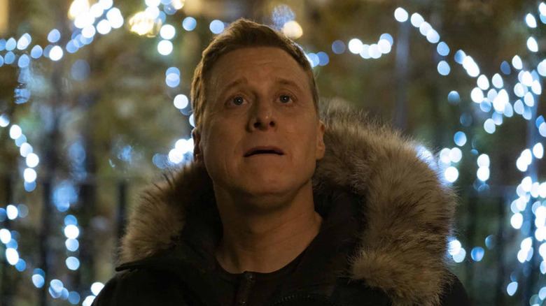 A surprised Harry Vanderspiegle (Alan Tudyk) looks up outside in Resident Alien