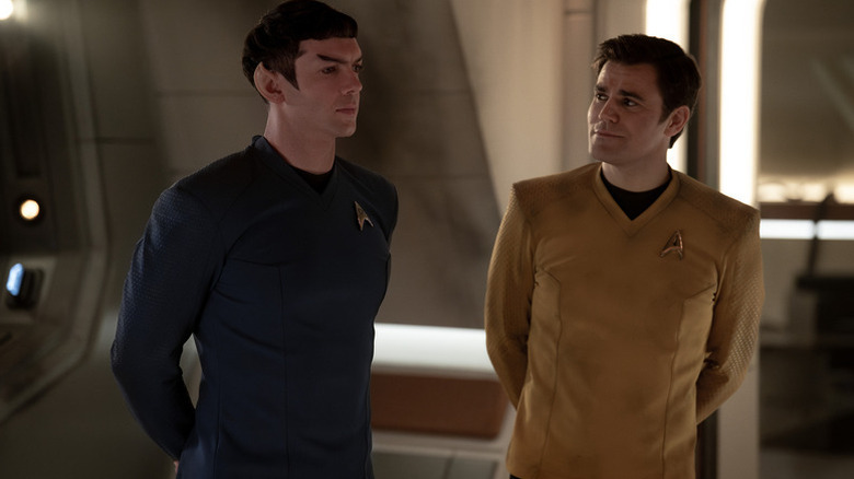 Jim Kirk (Paul Wesley) smiles at Spock (Ethan Peck) in Star Trek: Strange New Worlds
