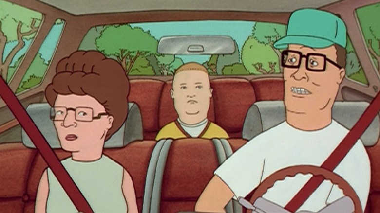 Peggy, Bobby, and Hank sitting in the car on King of the Hill