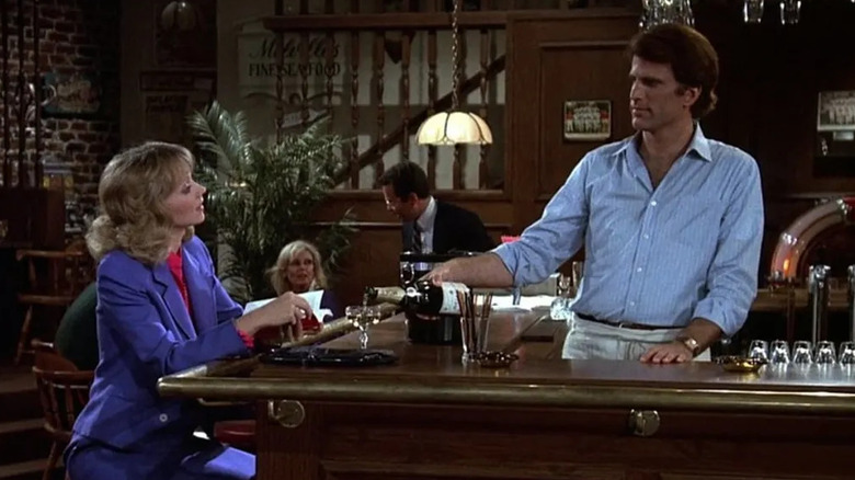 Shelley Long as Diane sitting at a bar tended by Ted Danson as Sam in Cheers