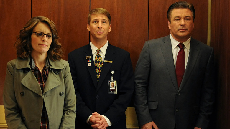 Liz, Kenneth, and Jack sharing an elevator in 30 Rock