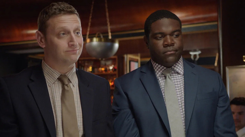 Tim and Sam wearing suits in Detroiters