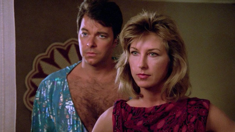 Will Riker (Jonathan Frakes) and Beata (Karen Montgomery) stand in a bedroom in Star Trek: The Next Generation