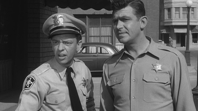Barney Fife (Don Knotts) and Andy Taylor (Andy Griffith) look confused on The Andy Griffith Show