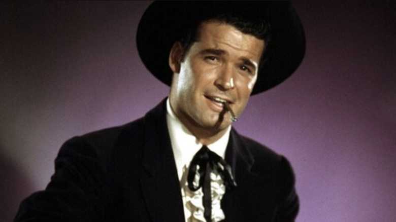Bret Maverick (James Garner) smokes a cigarette on Maverick