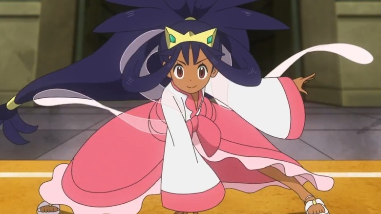 Iris crouching during a Pokemon battle