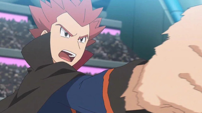 Lance holding out his fist