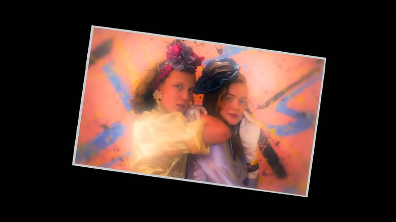 A photograph of El (Millie Bobby Brown) and Max (Sadie Sink) in Stranger Things
