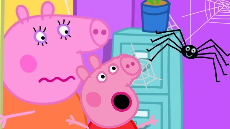 Animated Peppa Pig with mouth open and smiling spider in front of her and mom behind her in Peppa Pig