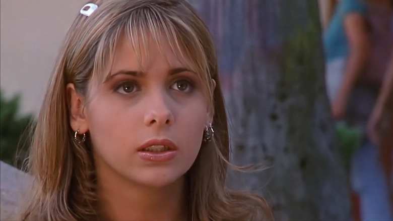 Sarah Michelle Gellar's Buffy Summers looking up in Buffy the Vampire Slayer