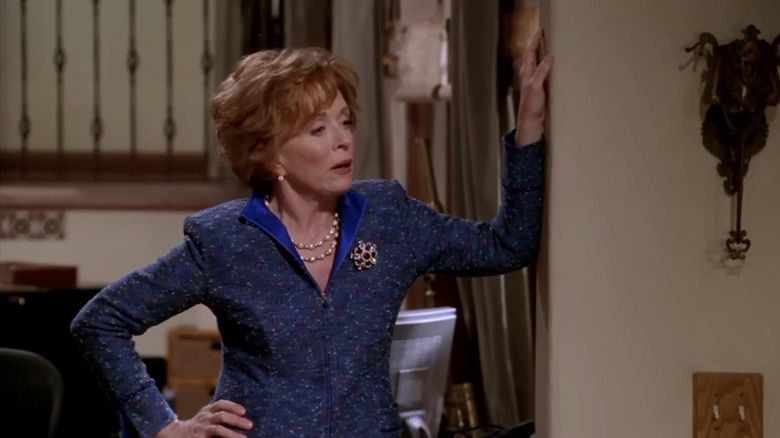 Holland Taylor's Evelyn Harper leaning against the wall in Two and a Half Men