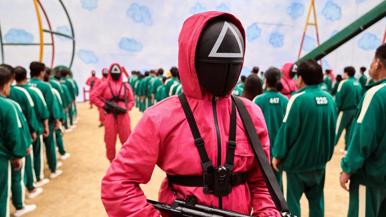 Creepy masked guard in Squid Game