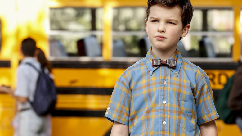 Sheldon Cooper (Iain Armitage) beside the bus in Young Sheldon