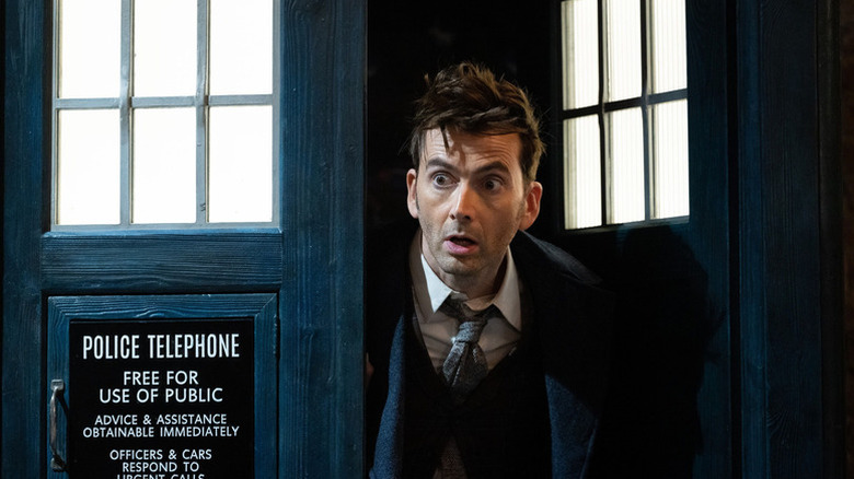 The Doctor (David Tennant) peers out of the TARDIS in Doctor Who