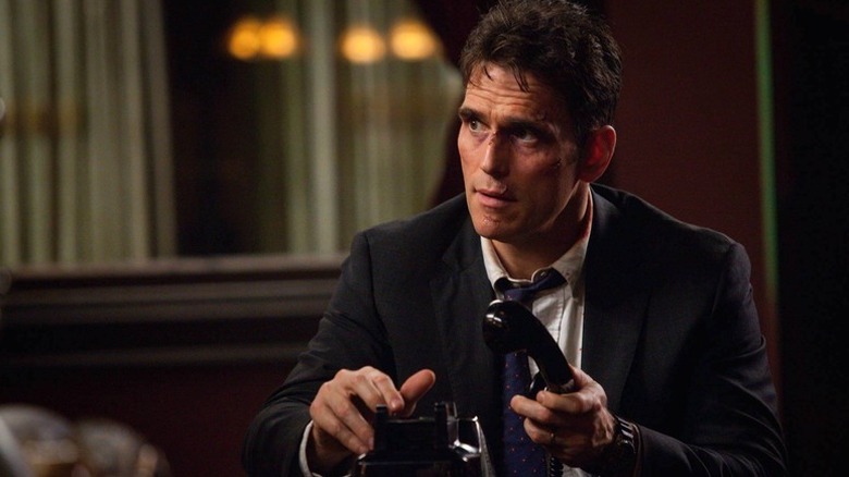 Ethan Burke (Matt Dillon) answers a phone in Wayward Pines