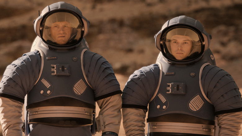 Joel Kinnaman as Edward "Ed" Baldwin  and Casey W. Johnson as Danny Stevens wearing blue space suits in For All Mankind
