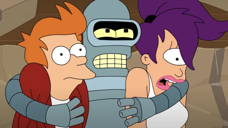 Billy West voicing Philip J. Fry, John DiMaggio voicing Bender Bending Rodriguez, and Katey Sagal voicing Turanga Leela while in an unwanted hug in Futurama
