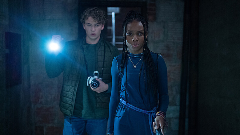 Will Meyers as Anthony and Kaci Walfall as Naomi hunt for clues on Naomi.