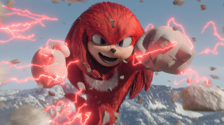 Knuckles (Idris Elba) punches through rocks in Knuckles