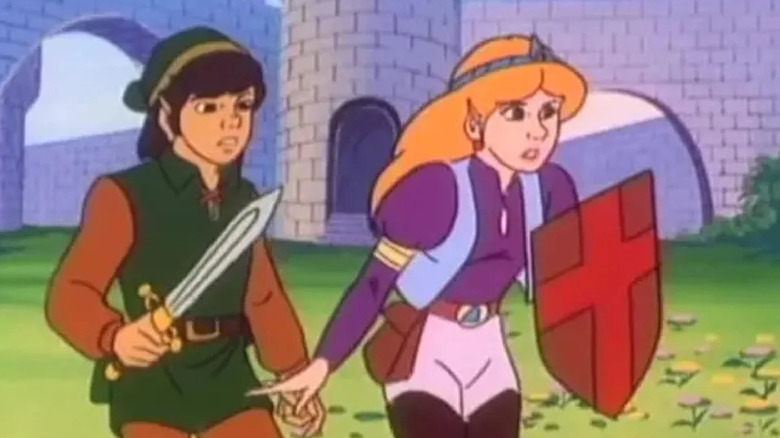 Link (Jonathan Potts) holds a sword next to Princess Zelda (Cyndy Preston) holding a shield in The Legend of Zelda