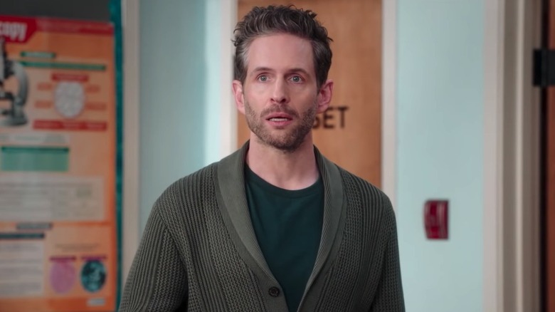 Glenn Howerton as Jack standing in classroom in sweater in A.P. Bio