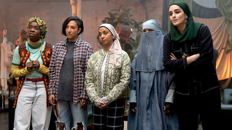 Faith Omole as Bisma in colorful headscarf, Sarah Kameela Impey as Saira in flannel, Anjana Vasan as Amina in light-colored hijab, Lucie Shorthouse as Momtaz in blue niqab, and Juliette Motamed in green hijab as Ayesha in We Are Lady Parts