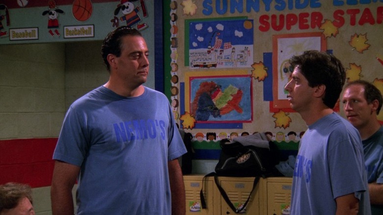 Robert and Ray facing each other in the locker room on Everybody Loves Raymond S1E11