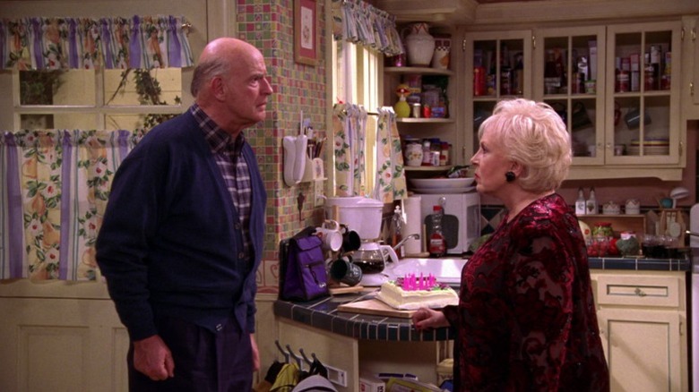 Frank and Marie standing face-to-face in Ray and Debra's kitchen on Everybody Loves Raymond S6E3