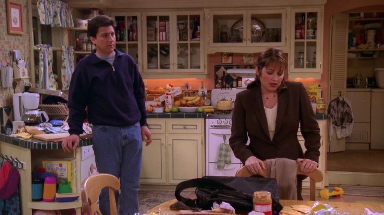 Ray looking at a frustrated Debra from afar in the kitchen on Everybody Loves Raymond S3E22