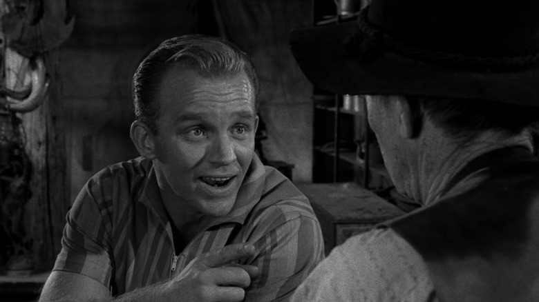 Floyd Burney (Gary Crosby) speaks excitedly to a man in The Twilight Zone (1959)