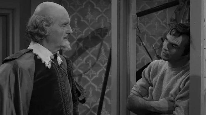 William Shakespeare (John Williams) speaks with Rocky Rhodes (Burt Reynolds) on a set in The Twilight Zone (1959)