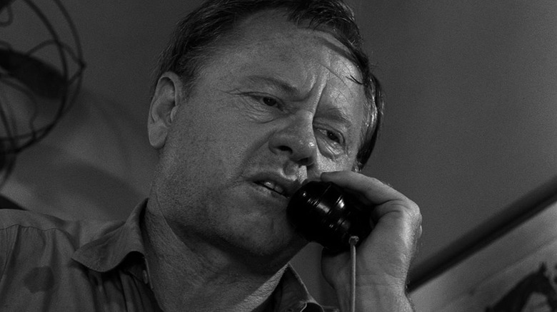 Michael Grady (Mickey Rooney) speaks on a telephone in The Twilight Zone (1959)