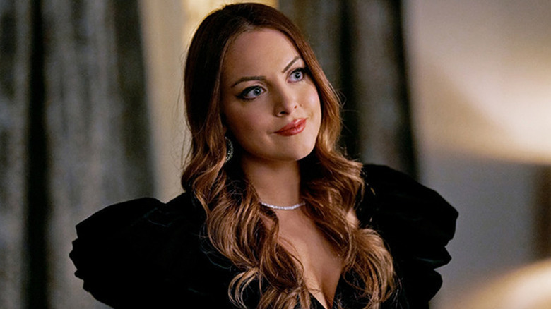 Elizabeth Gillies in black dress as Fallon in Dynasty